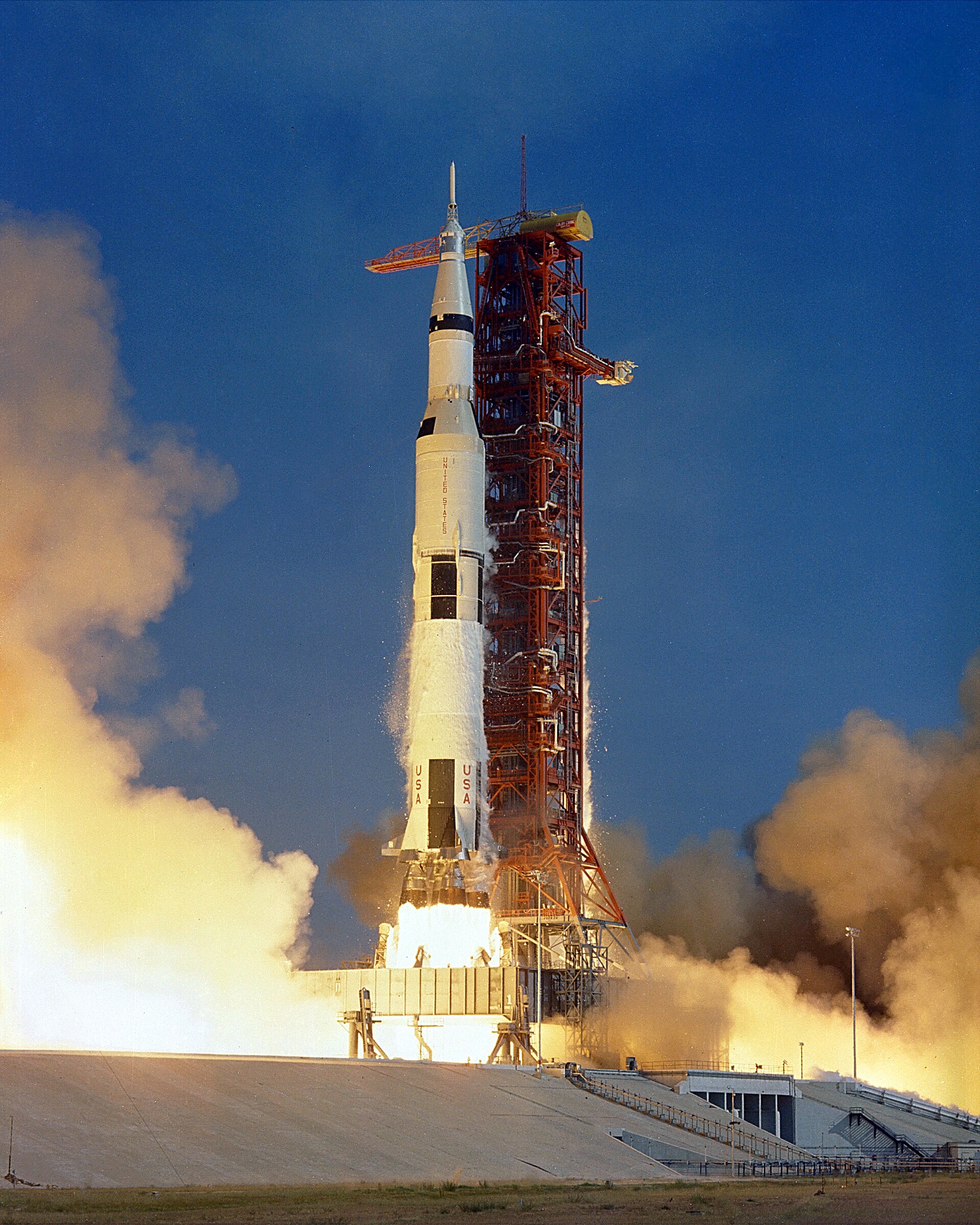 A Saturn V launching from Kennedy Space Center, viewed from Titusville across the Indian River Lagoon.